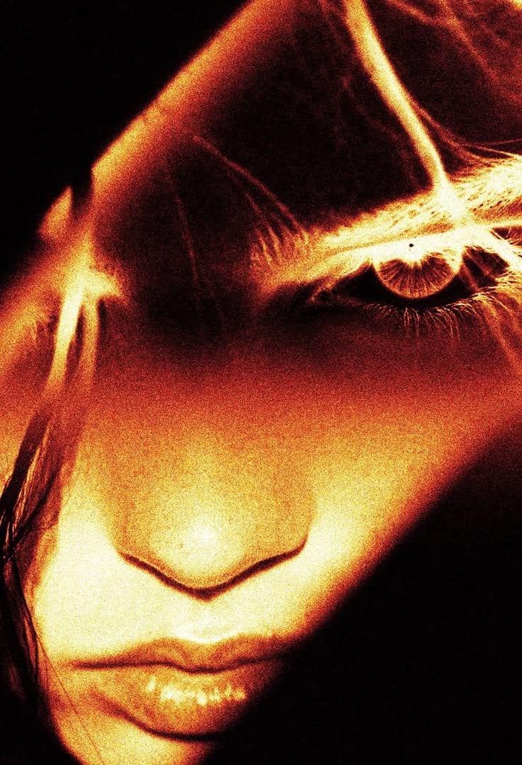 High-contrast portrait in amber light