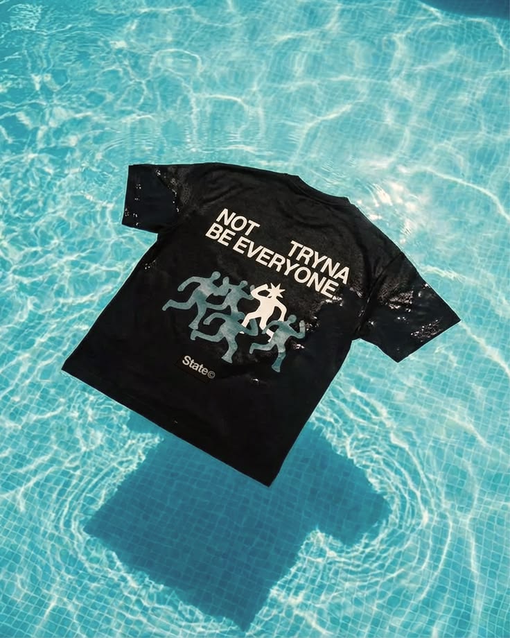 Black tee floating in a swimming pool