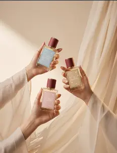 Fragrance bottles held in draped fabric