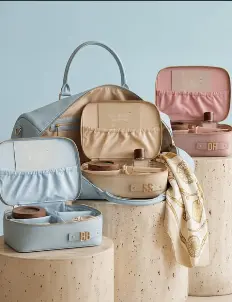 Travel bag sets arranged on stone plinths
